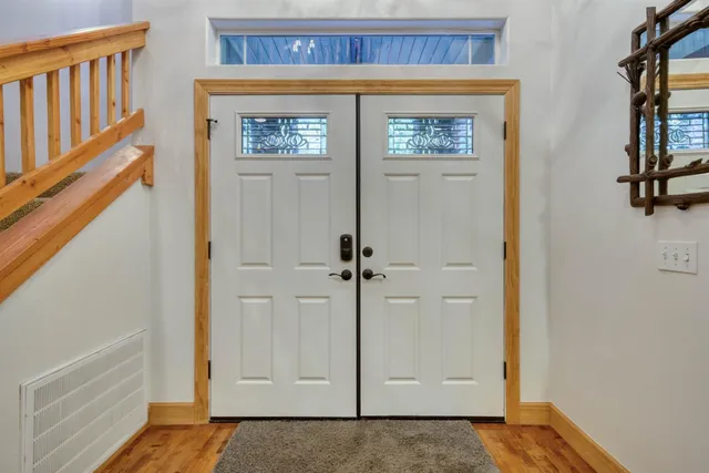 a view of front door with a hallway