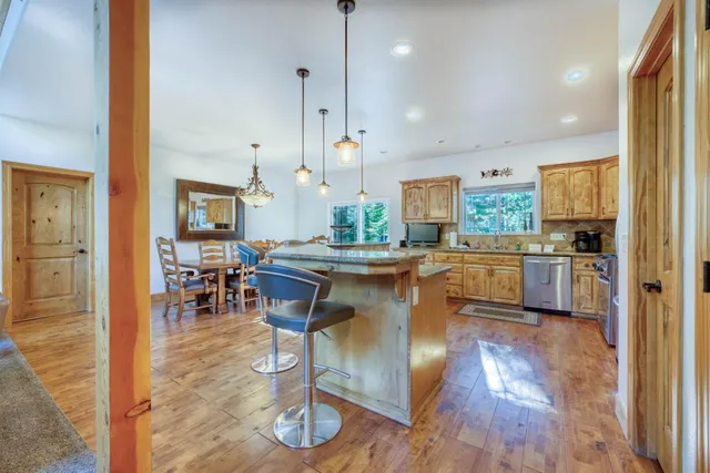 a living room with fireplace furniture and a large window