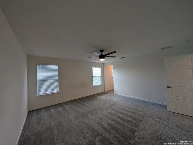 a view of backyard with green space