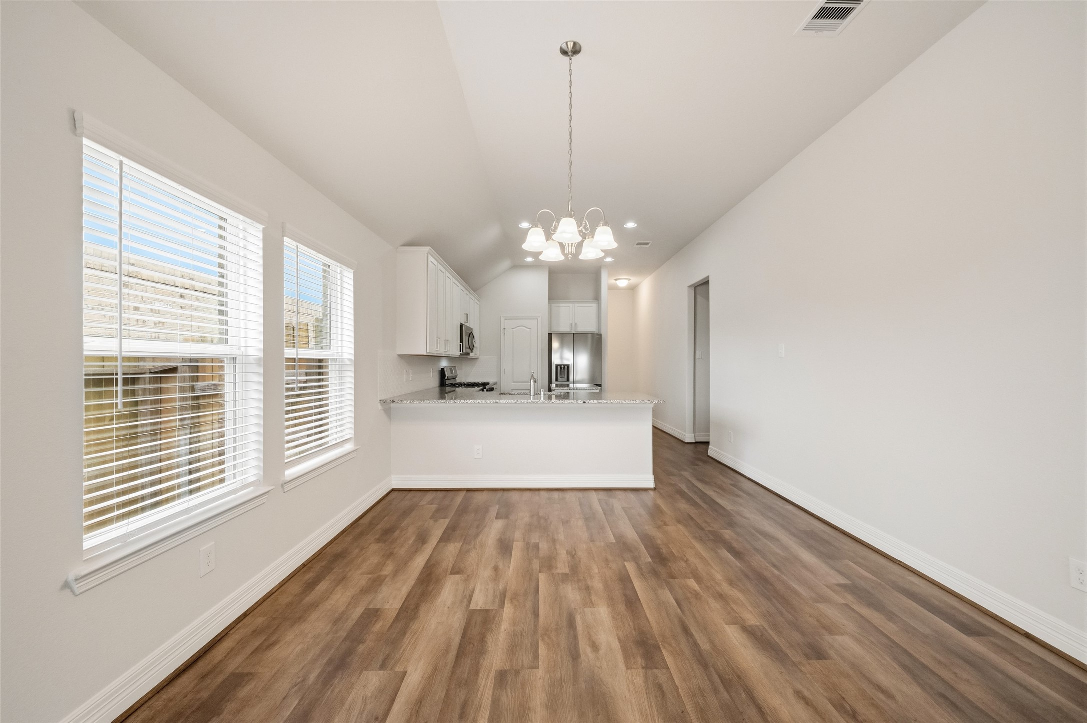 22642 Rosebush Hl Road Tomball, TX 77377 - Photo 14 of 27 a view of a room with wooden floor and large windows