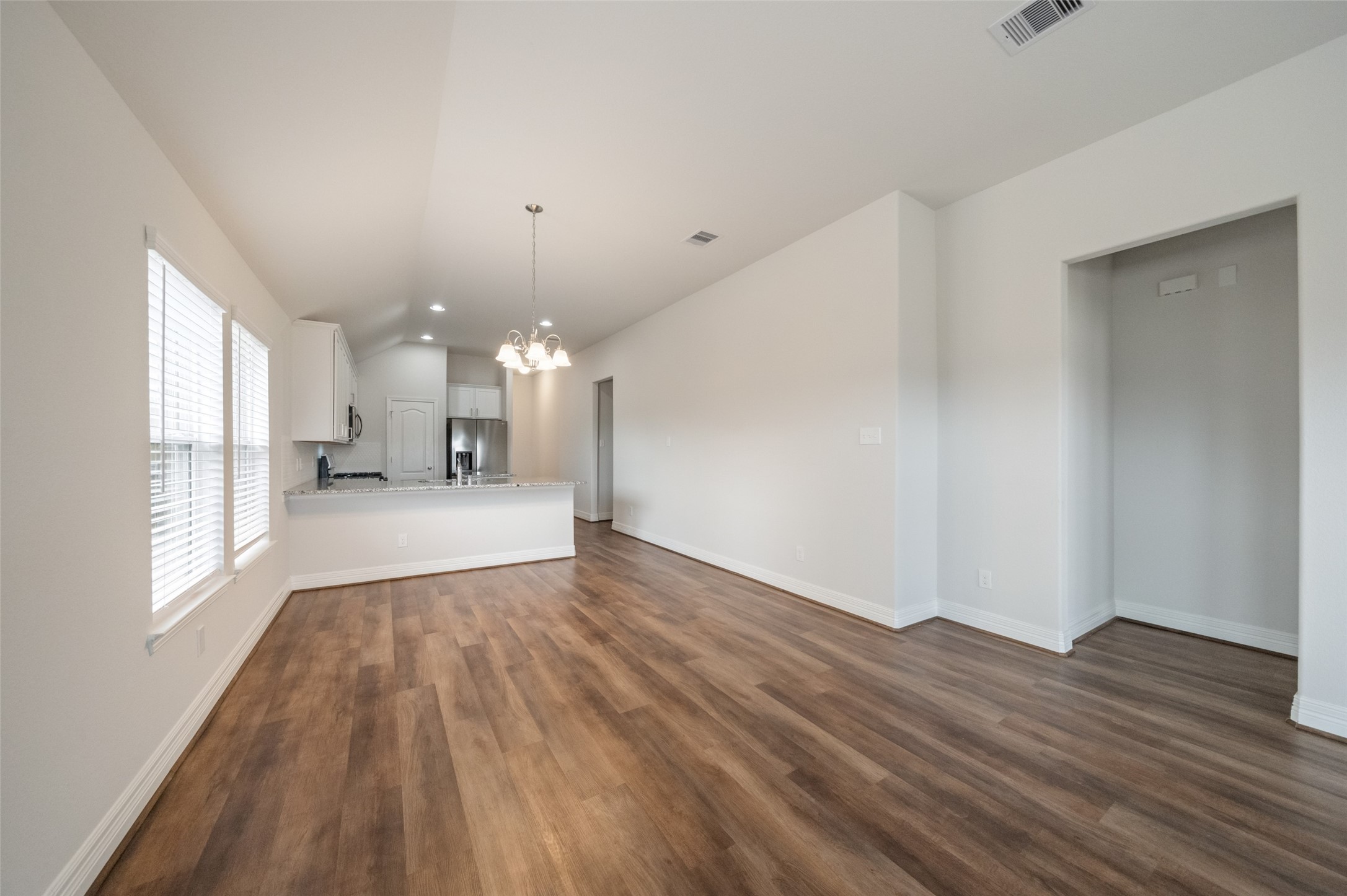 22642 Rosebush Hl Road Tomball, TX 77377 - Photo 15 of 27 a view of a big room with wooden floor and windows