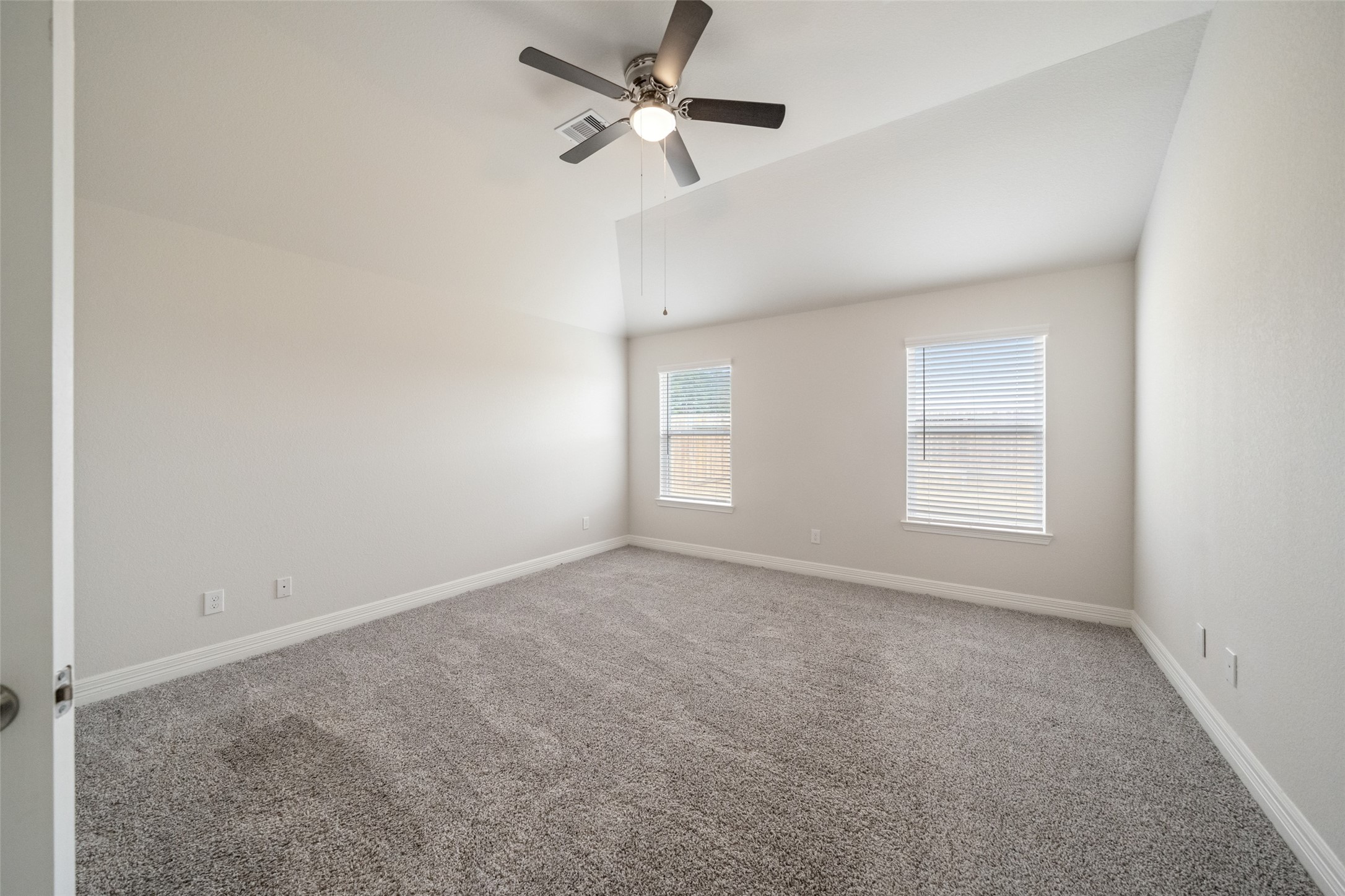 22642 Rosebush Hl Road Tomball, TX 77377 - Photo 16 of 27 an empty room with a window and a fan
