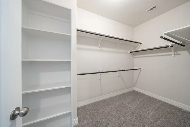 a view of an empty walk in closet
