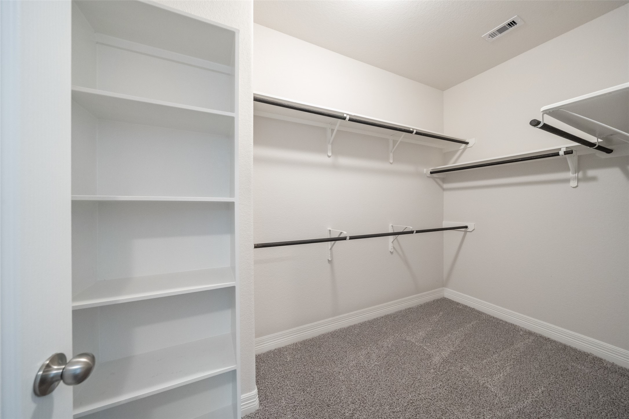 22642 Rosebush Hl Road Tomball, TX 77377 - Photo 18 of 27 a view of an empty walk in closet