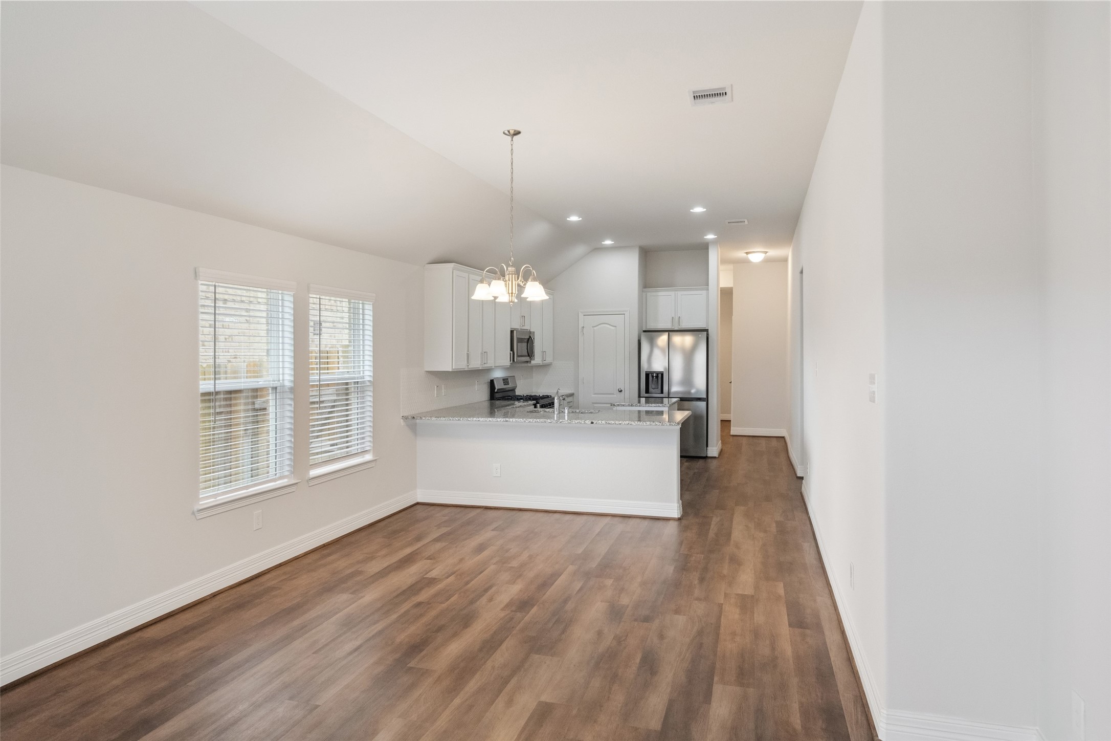 22642 Rosebush Hl Road Tomball, TX 77377 - Photo 20 of 27 a view of a kitchen with a sink and wooden floor