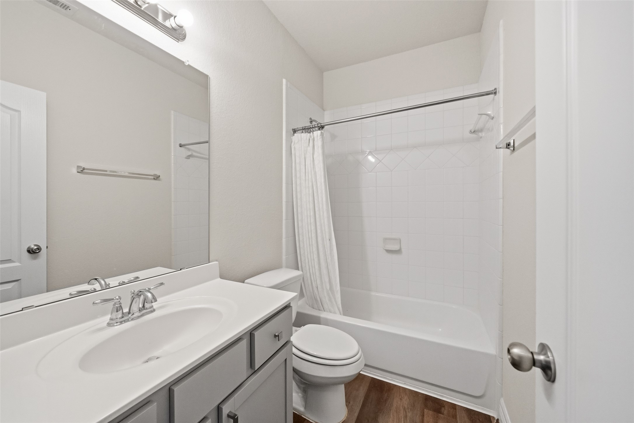 22642 Rosebush Hl Road Tomball, TX 77377 - Photo 22 of 27 a bathroom with a sink toilet mirror vanity and shower