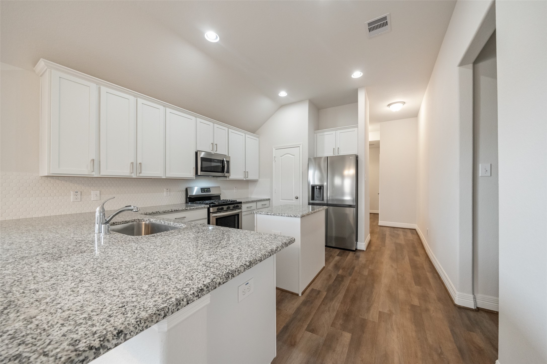 22642 Rosebush Hl Road Tomball, TX 77377 - Photo 6 of 27 a kitchen with granite countertop a sink a counter space stainless steel appliances and cabinets