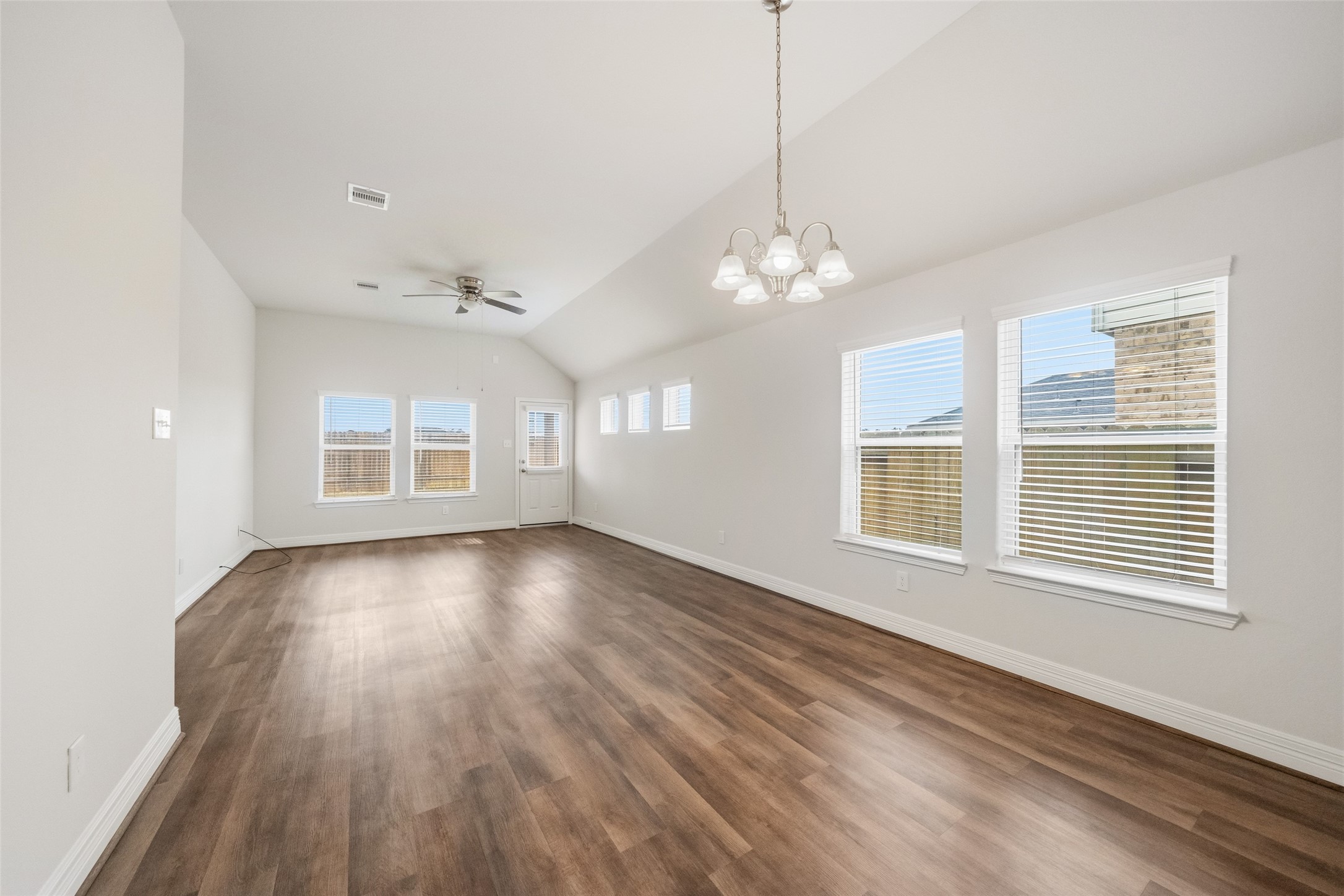 22642 Rosebush Hl Road Tomball, TX 77377 - Photo 7 of 27 a view of an empty room with wooden floor and a window