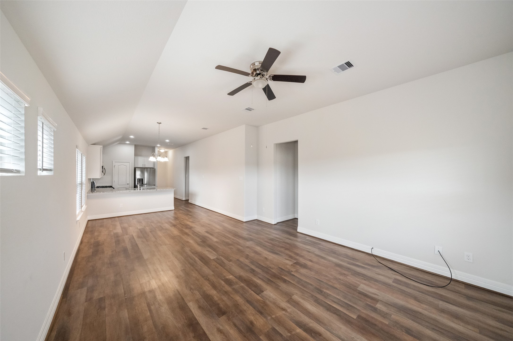 22642 Rosebush Hl Road Tomball, TX 77377 - Photo 9 of 27 a view of empty room with wooden floor and windows