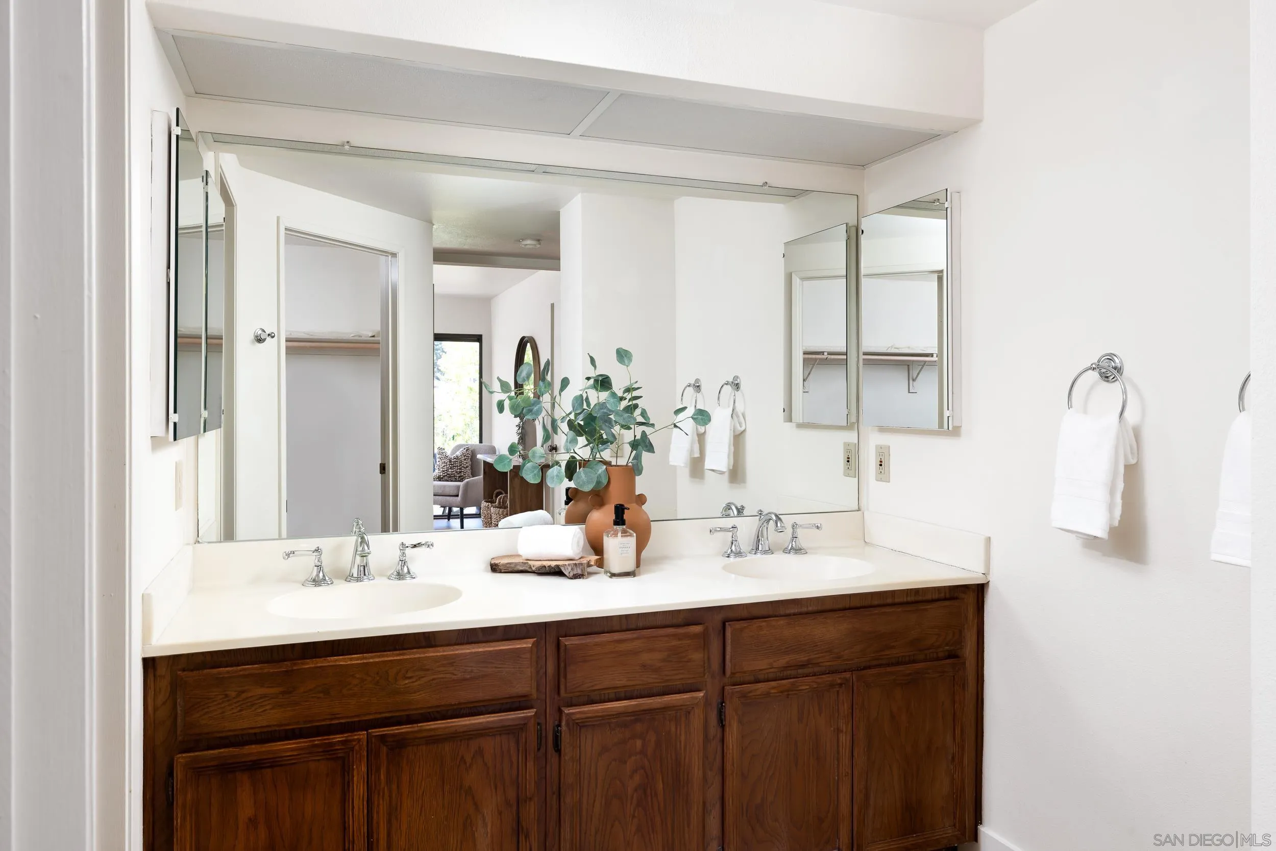 7306 Alta Vista Carlsbad, CA 92009 - Photo 12 of 22 a bathroom with a sink and a mirror