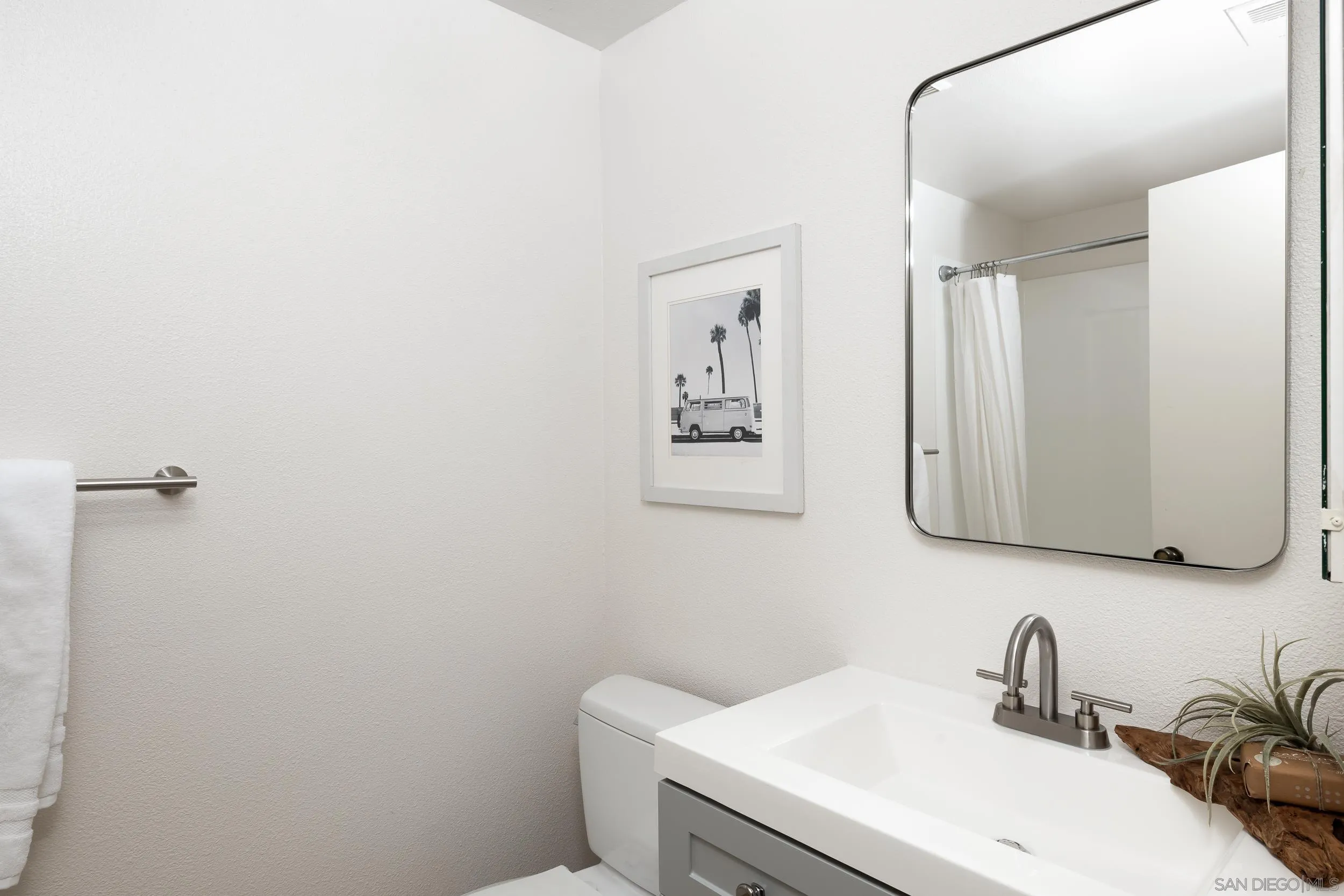 7306 Alta Vista Carlsbad, CA 92009 - Photo 15 of 22 a bathroom with a sink and mirror