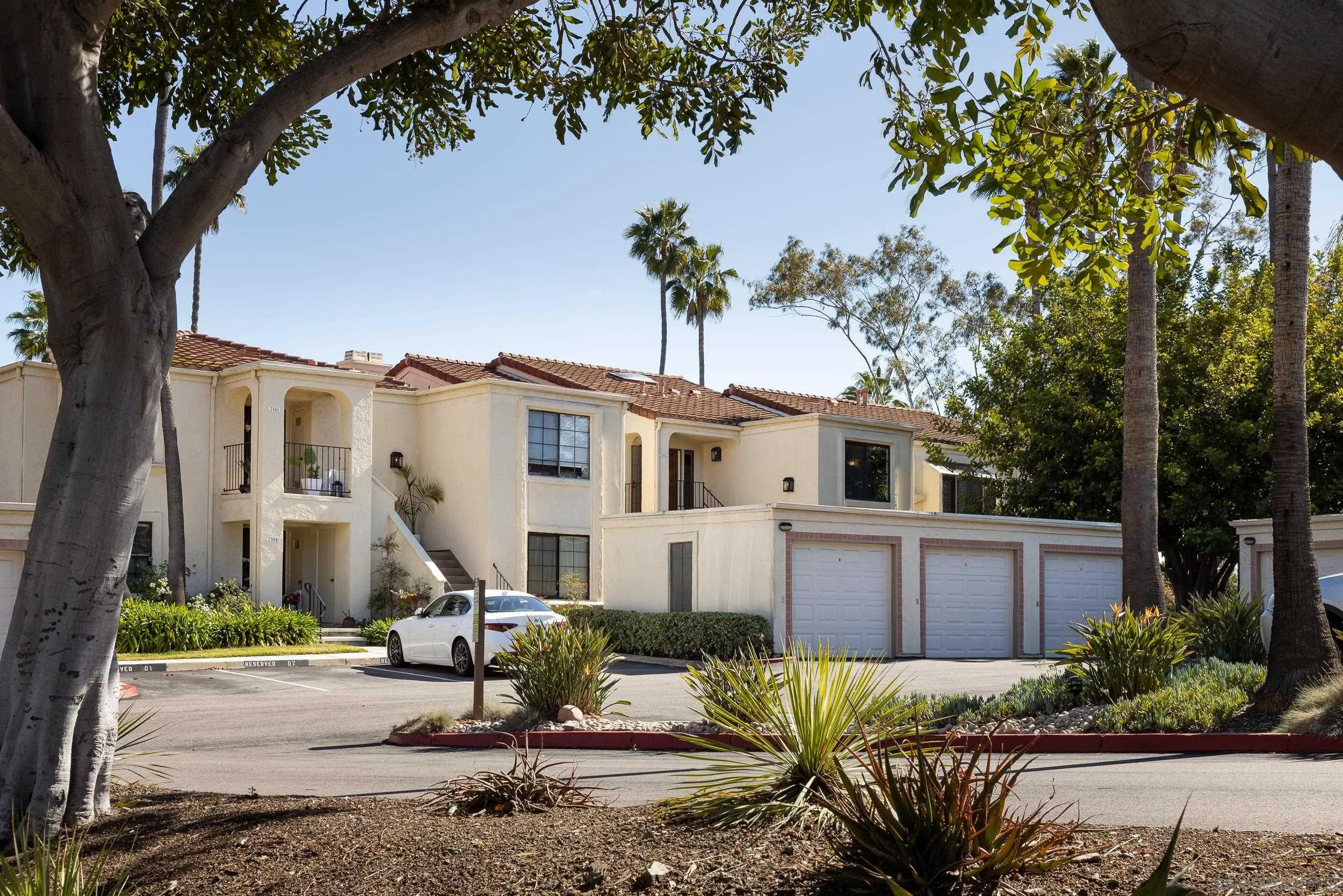 7306 Alta Vista Carlsbad, CA 92009 - Photo 17 of 22 a front view of a house with a tree