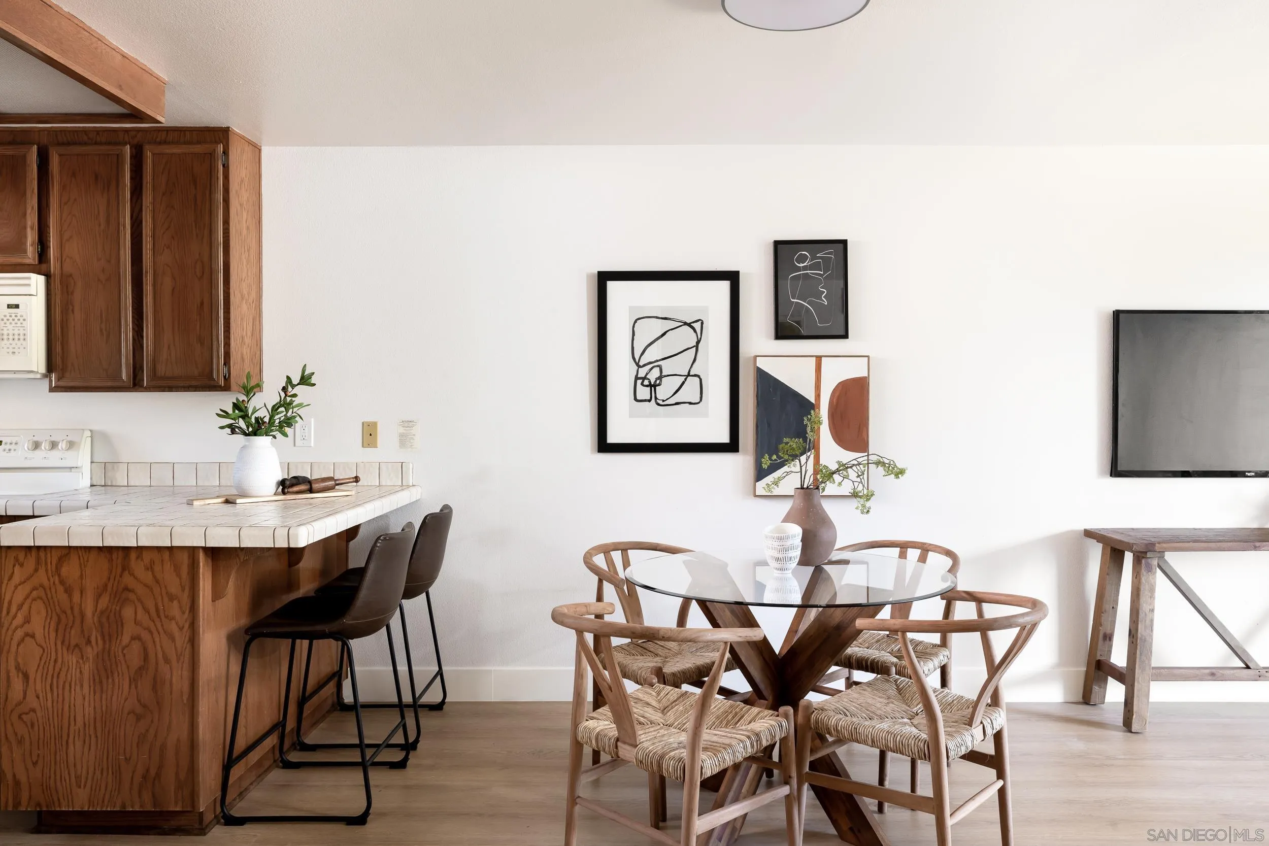 7306 Alta Vista Carlsbad, CA 92009 - Photo 6 of 22 a view of a dining room with furniture and wooden floor