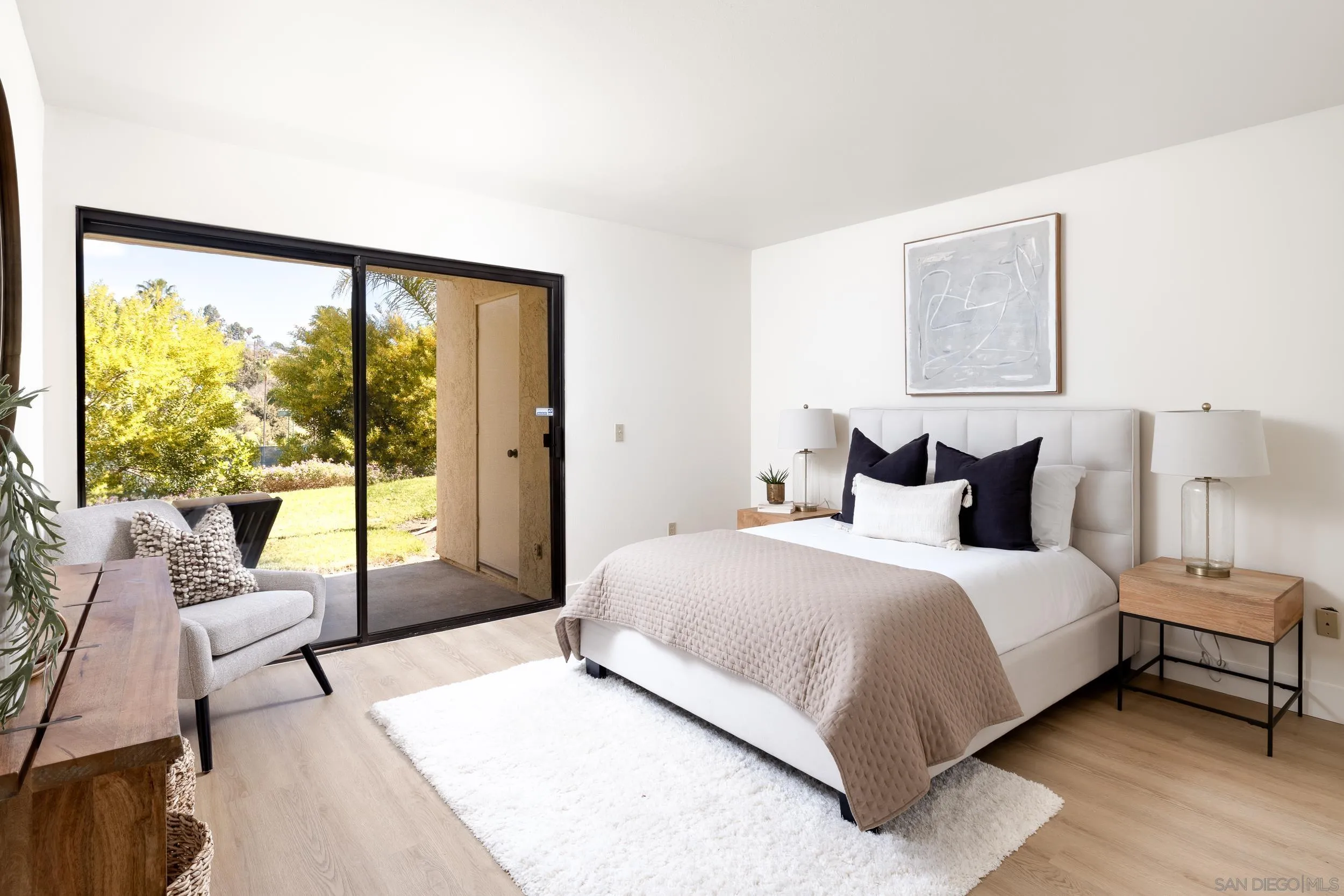 7306 Alta Vista Carlsbad, CA 92009 - Photo 10 of 22 a bedroom with a large bed and a large window