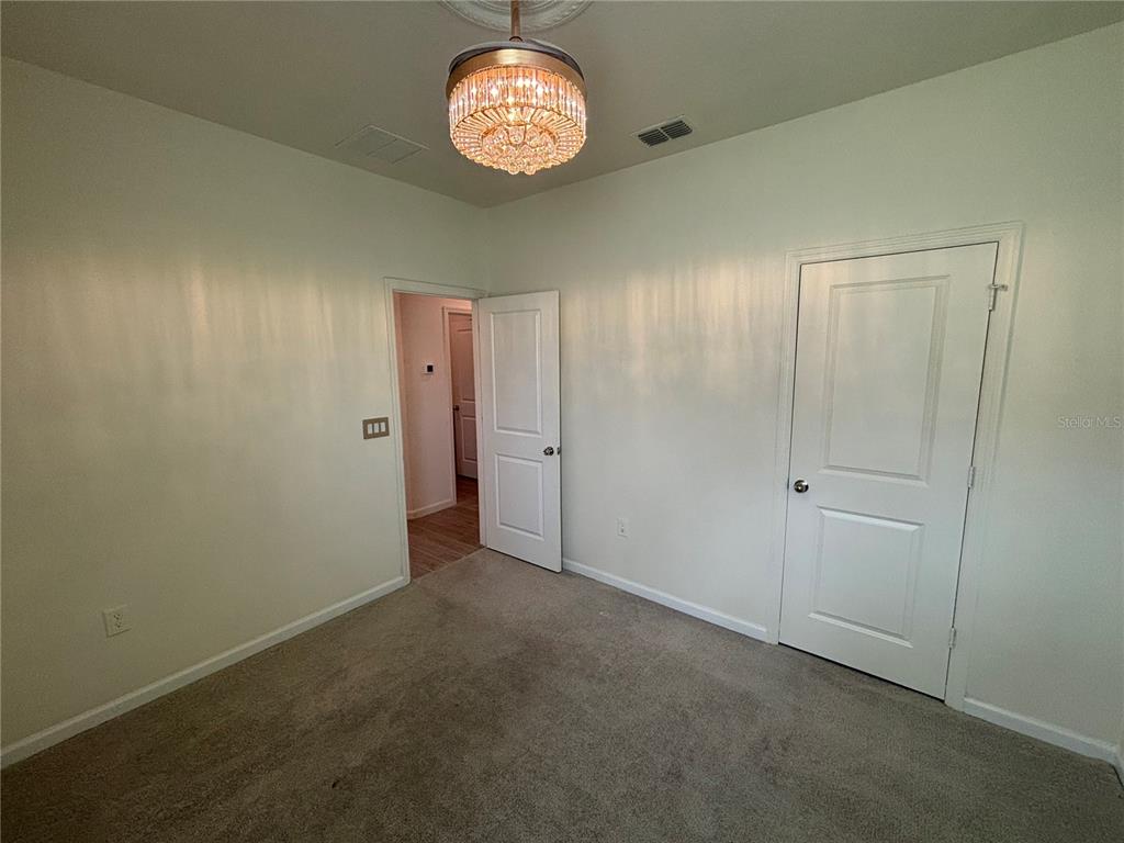 9145 Southwest 58th Circle Ocala, FL 34476 - Photo 19 of 37 an empty room with a hallway