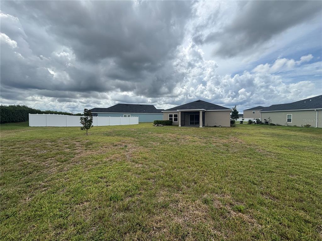9145 Southwest 58th Circle Ocala, FL 34476 - Photo 35 of 37 a large pool with lawn chairs and a yard