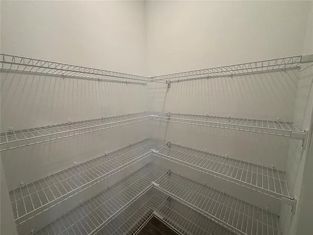 a view of a room with racks on the wall