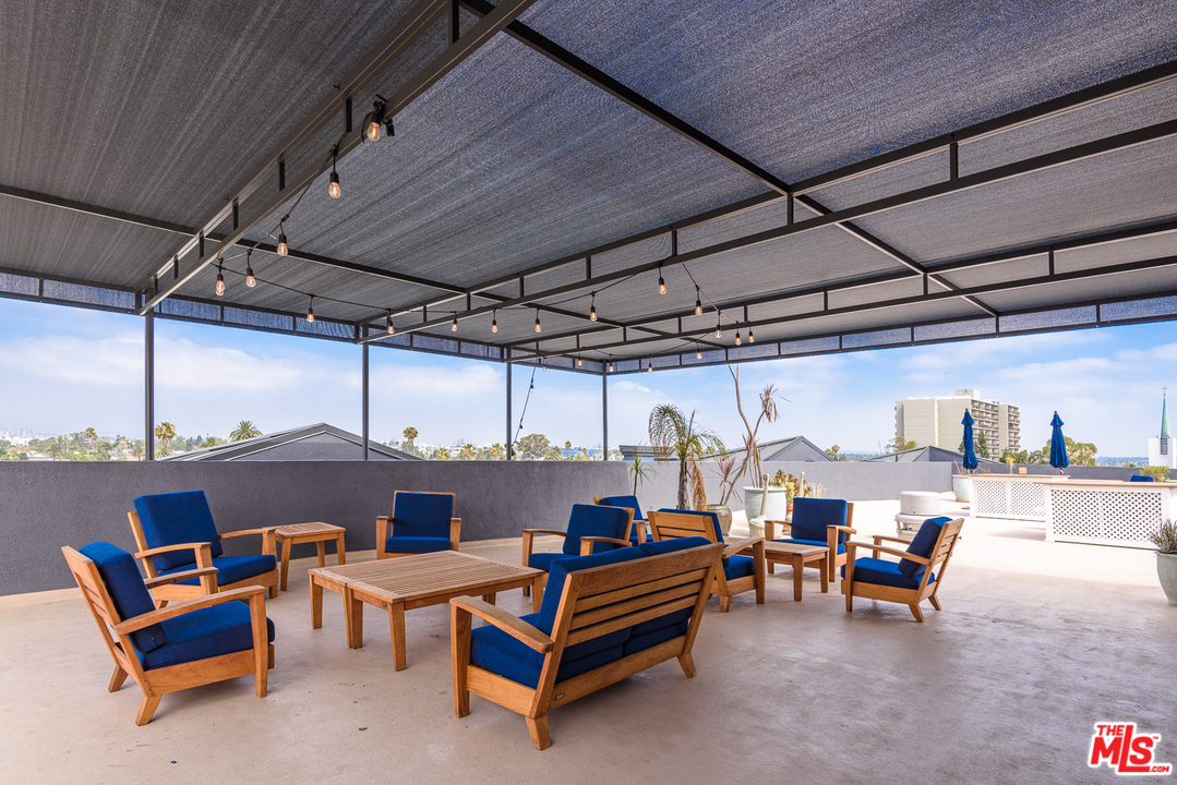 838 Pine Avenue, Unit 216 Long Beach, CA 90813 - Photo 25 of 35 a outdoor space with patio lots of white furniture