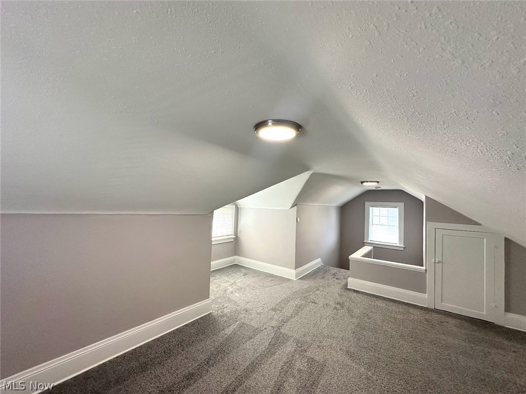 3409 Cedarbrook Road Cleveland Heights, OH 44118 - Photo 14 of 16 Bonus room featuring dark colored carpet and a textured ceiling