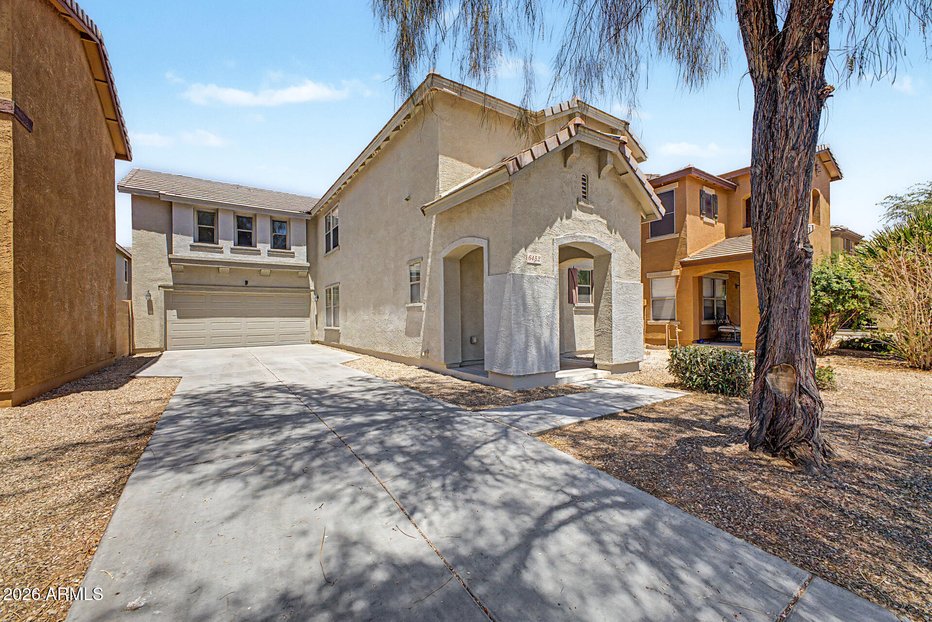 6452 West Ruth Avenue Glendale, AZ 85302 - Photo 2 of 35 a front view of a house with a yard