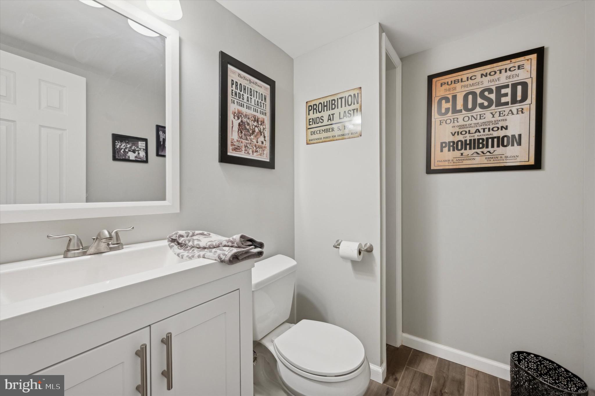 5229 North Springfield Road Clifton Heights, PA 19018 - Photo 23 of 25 a bathroom with a granite countertop toilet sink and mirror