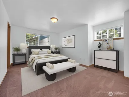 a bedroom with a bed and a table