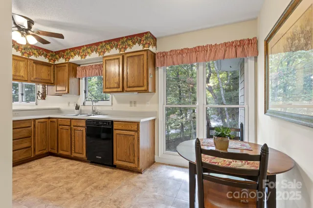a kitchen with a stove a sink and a refrigerator