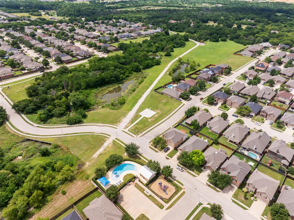4016 Lazy River Ranch Road Fort Worth, TX 76262 - Photo 38 of 40 Walking trail, basketball court, playground, and community pool at the end of the street