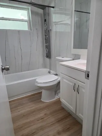 a bathroom with a toilet and a sink