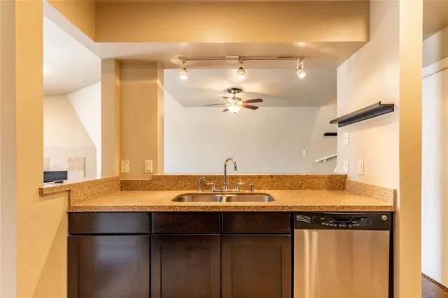 a view of a bathroom with a sink and a window