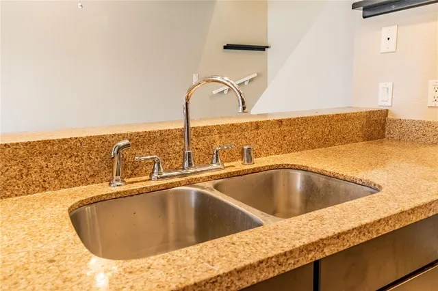 a kitchen with a sink and a stove