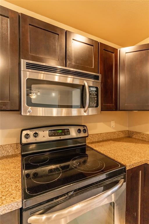 4777 Cedar Springs Road, Unit 8J Dallas, TX 75219 - Photo 18 of 30 a stove top oven sitting inside of a kitchen