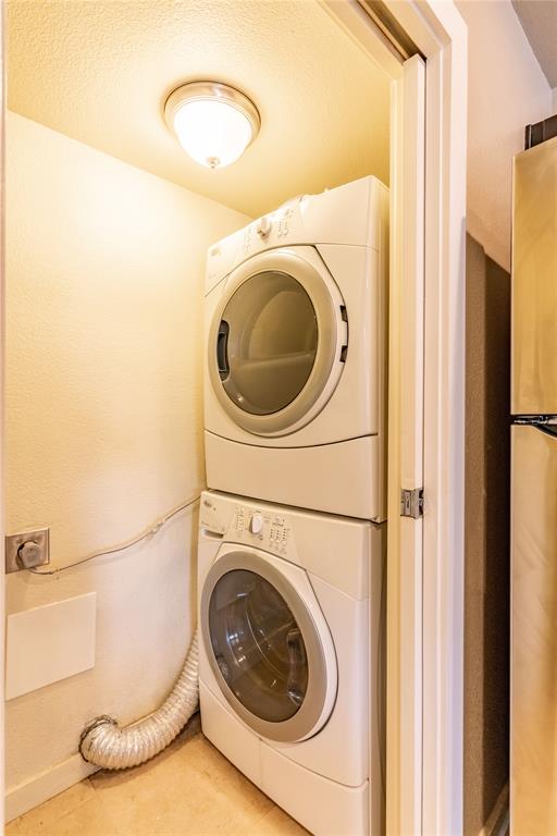 4777 Cedar Springs Road, Unit 8J Dallas, TX 75219 - Photo 19 of 30 a utility room with dryer and washer