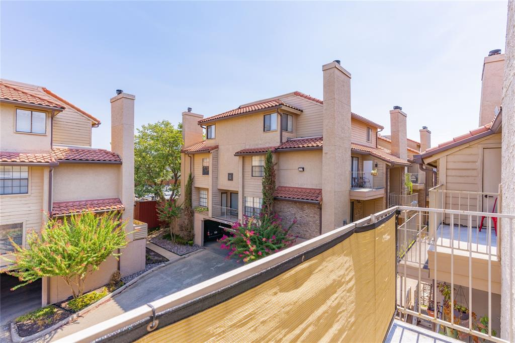 4777 Cedar Springs Road, Unit 8J Dallas, TX 75219 - Photo 22 of 30 a view of a house with a swimming pool