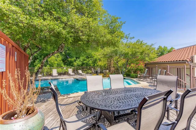 a view of backyard of house with seating space