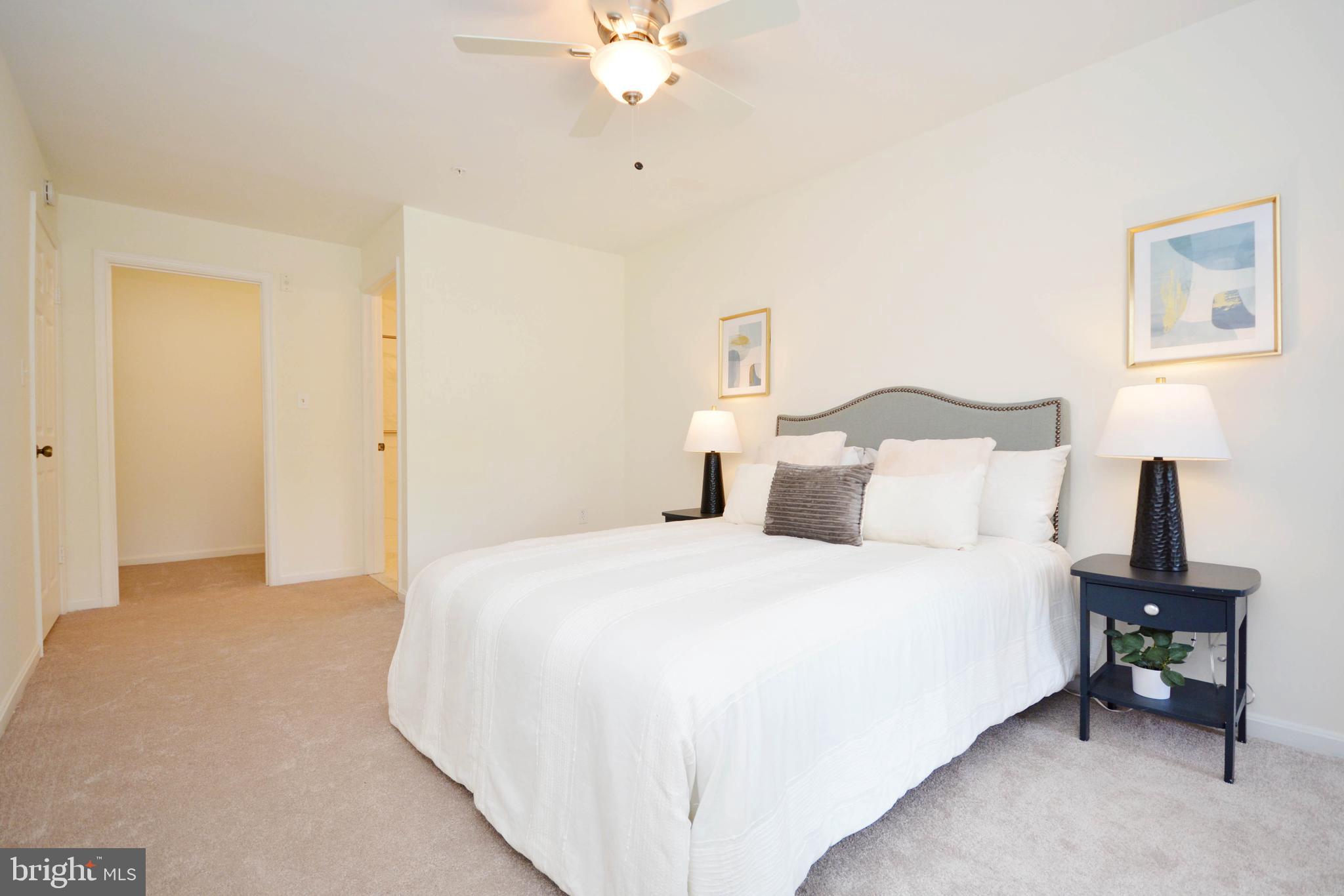 2900 Shipmaster Way, Unit 315 Annapolis, MD 21401 - Photo 12 of 39 a bedroom with a bed and a chandelier