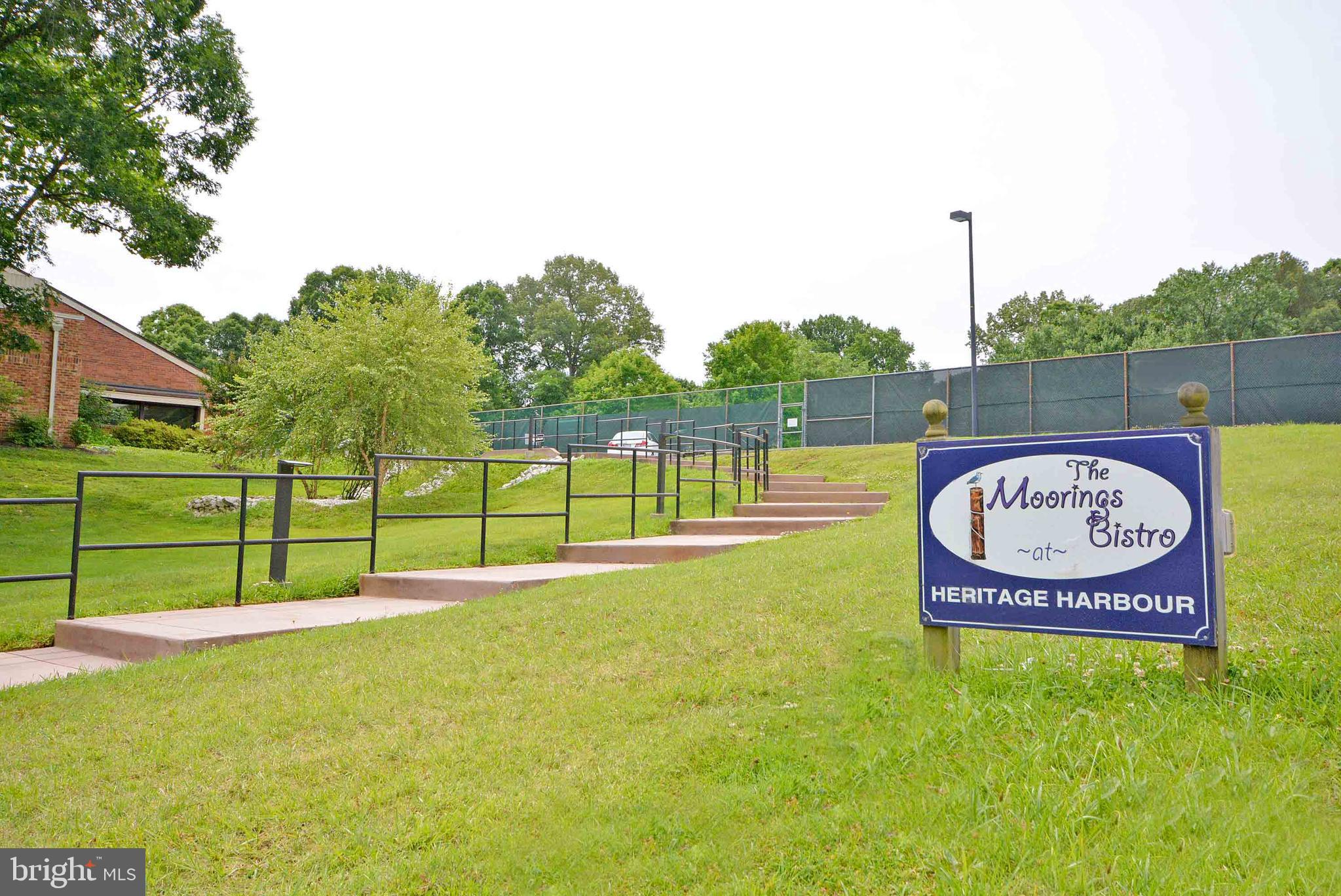 2900 Shipmaster Way, Unit 315 Annapolis, MD 21401 - Photo 29 of 39 a sign board with a play ground in the back