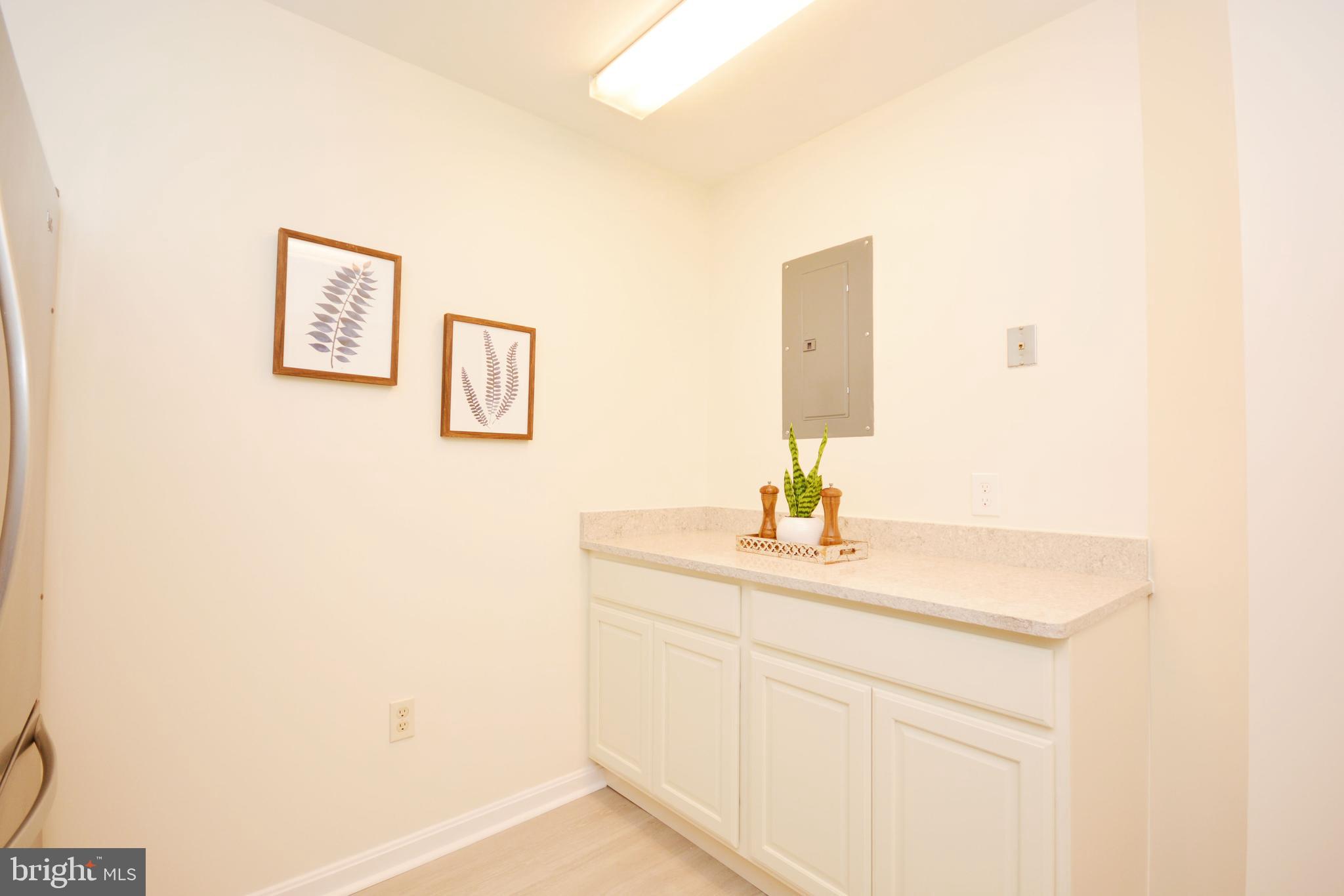 2900 Shipmaster Way, Unit 315 Annapolis, MD 21401 - Photo 7 of 39 a bathroom with a sink and a mirror