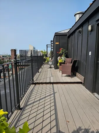 a view of balcony with furniture