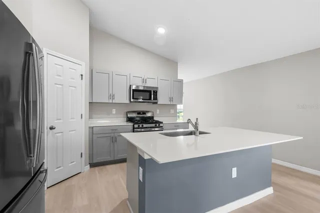 a living room with a flat screen tv and a fireplace