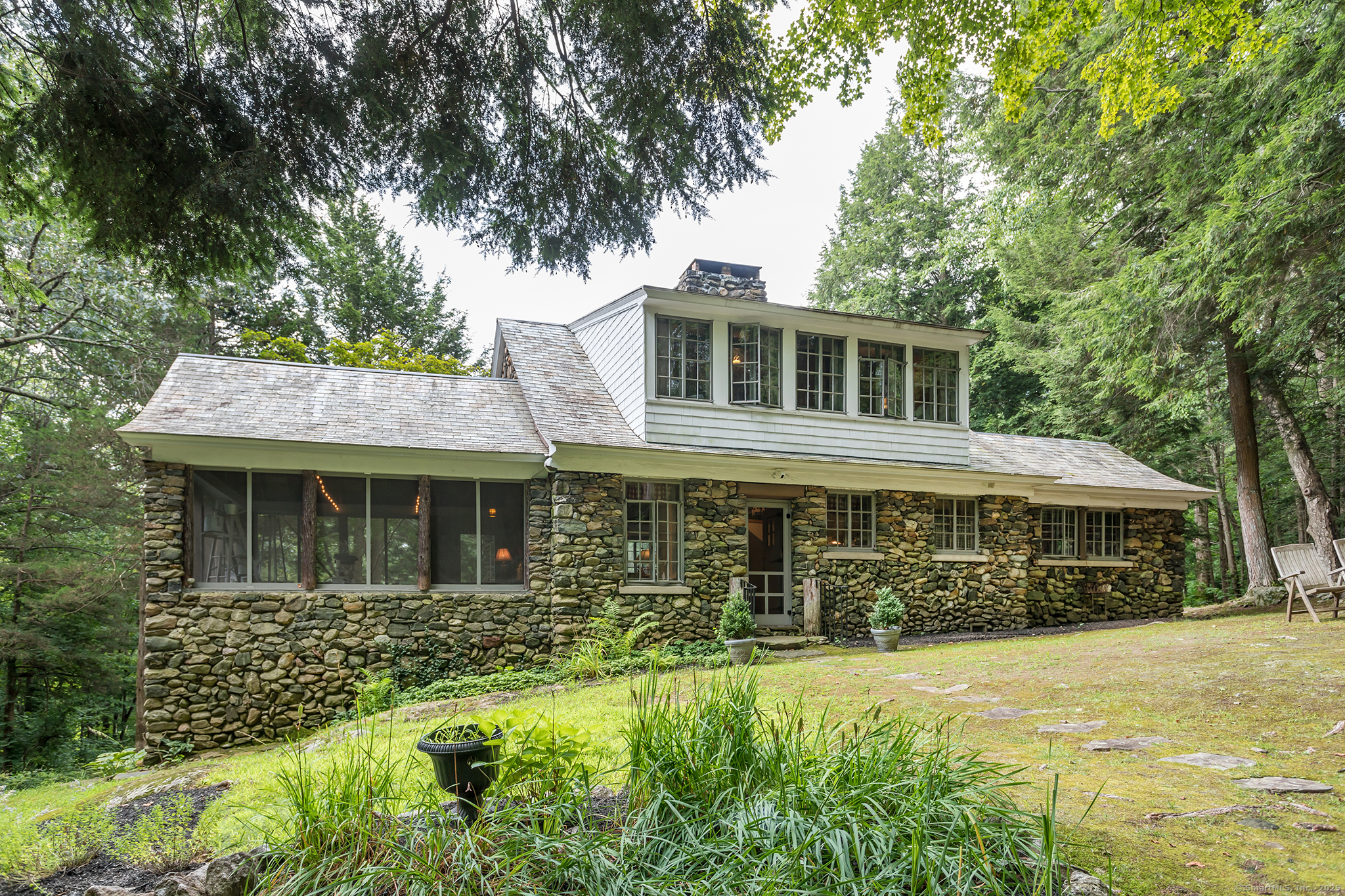 60 Leach Hollow Road Sherman, CT 06784 - Photo 2 of 24 a front view of a house with a yard