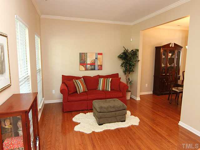 3335 Archdale Drive Raleigh, NC 27614 - Photo 2 of 15 a living room with furniture and a wooden floor