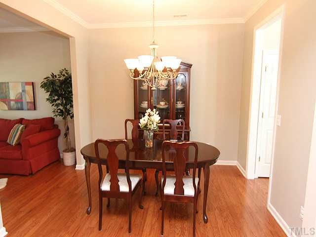 3335 Archdale Drive Raleigh, NC 27614 - Photo 3 of 15 a view of a dining room with furniture and wooden floor