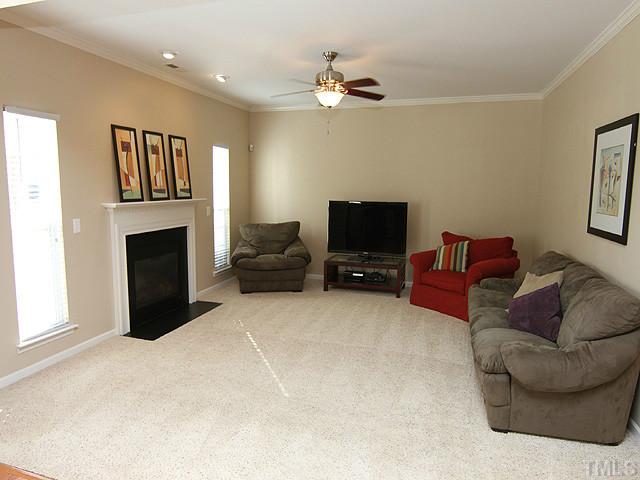 3335 Archdale Drive Raleigh, NC 27614 - Photo 6 of 15 a living room with furniture and a fireplace