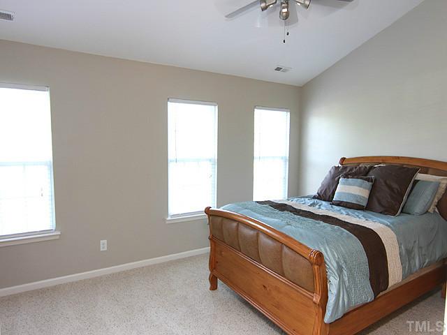 3335 Archdale Drive Raleigh, NC 27614 - Photo 7 of 15 a bedroom with a bed and window
