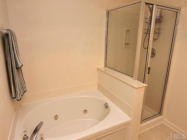 3335 Archdale Drive Raleigh, NC 27614 - Photo 8 of 15 a bathroom with a tub and a shower