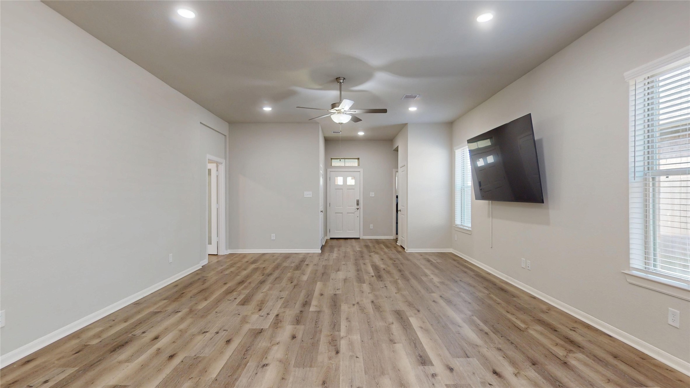 21586 Jordan Pond Ridge Porter, TX 77365 - Photo 6 of 30 Looking back toward front door. utily room with washer & dryer that stay is just off to the right of the front door.
The flex room door can be seen on the left.