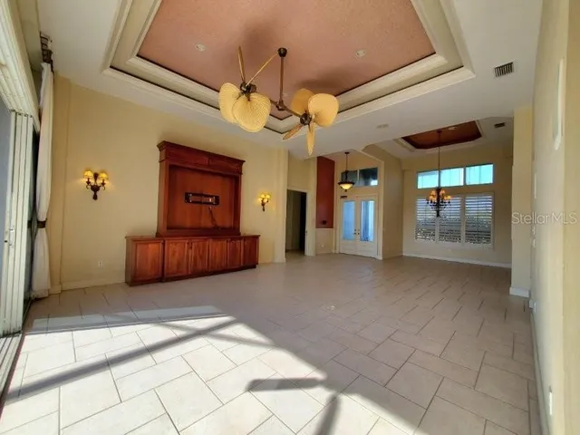 a lobby with furniture and a large window