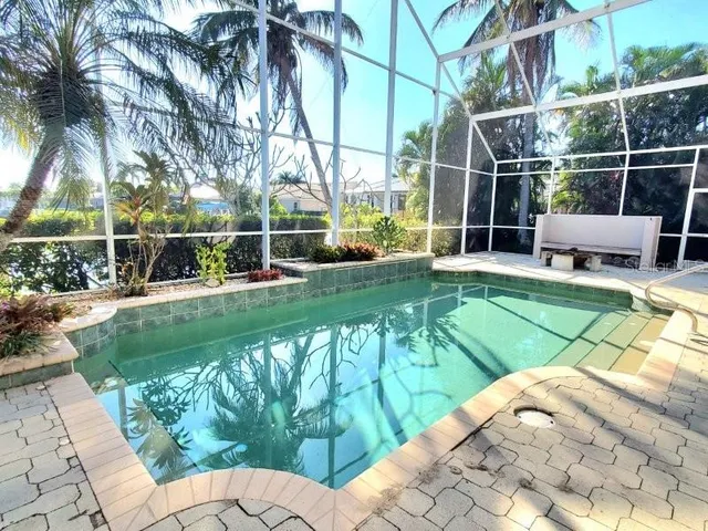 a view of yard with swimming pool and outdoor seating