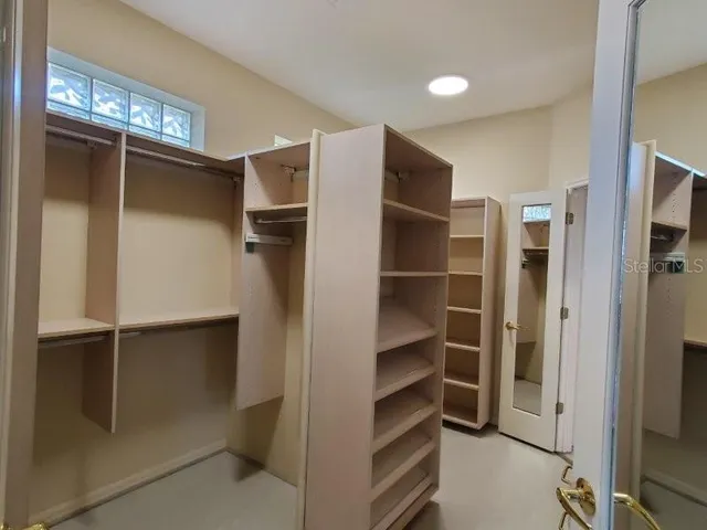 a bathroom with a granite countertop sink a mirror and a shower